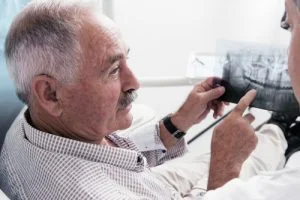 doctor and patient discussing about dental implant