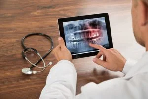 doctor examining on his ipad
