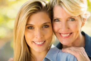 mother and daughter smiling